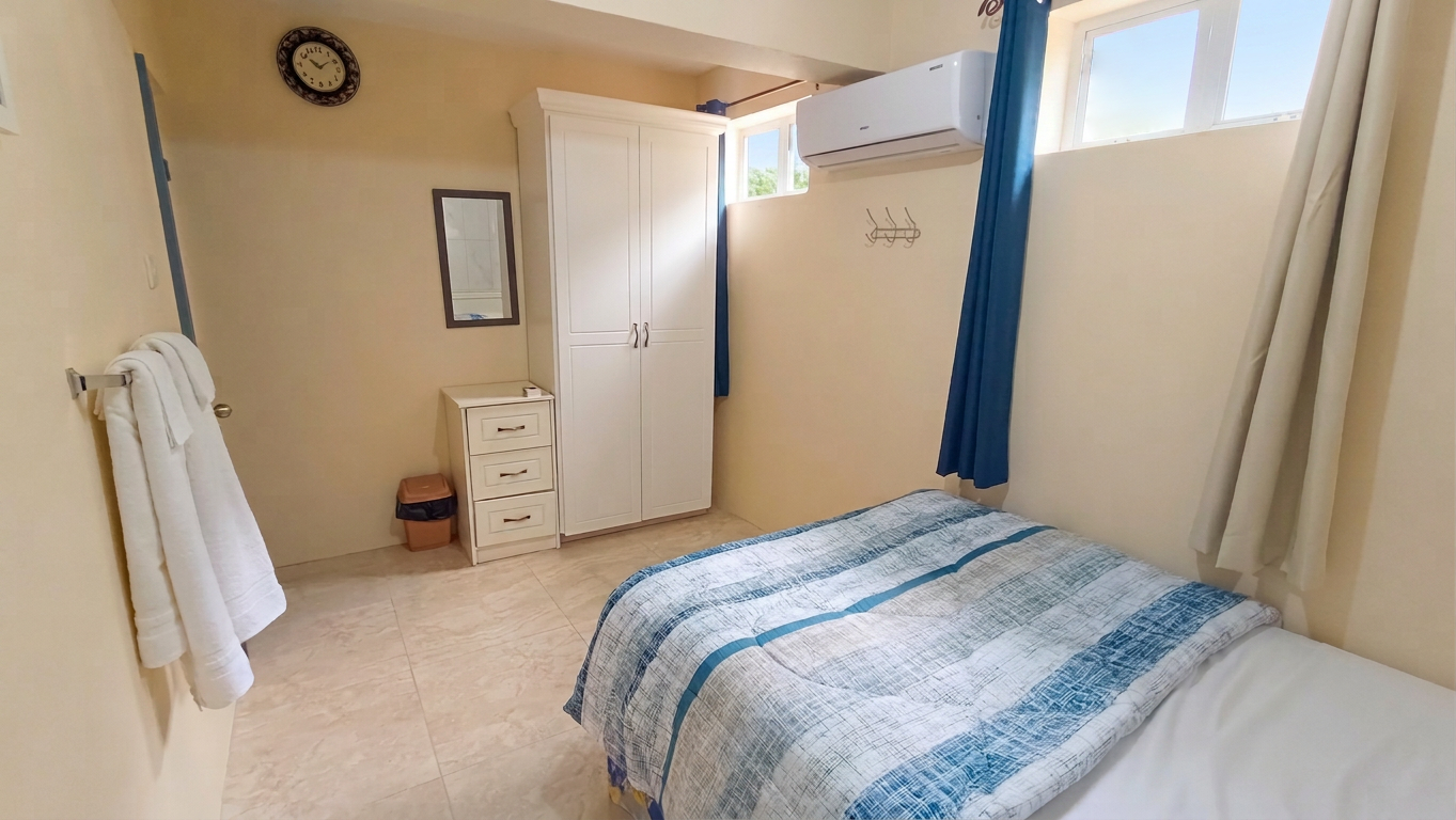 Bedroom one with storage and air conditioning